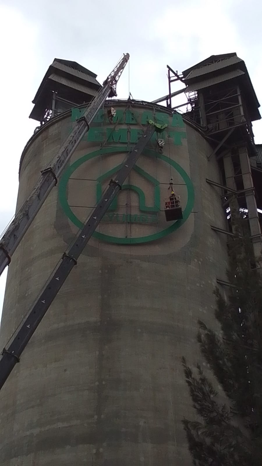 Assemboling Mombasa Cement sign